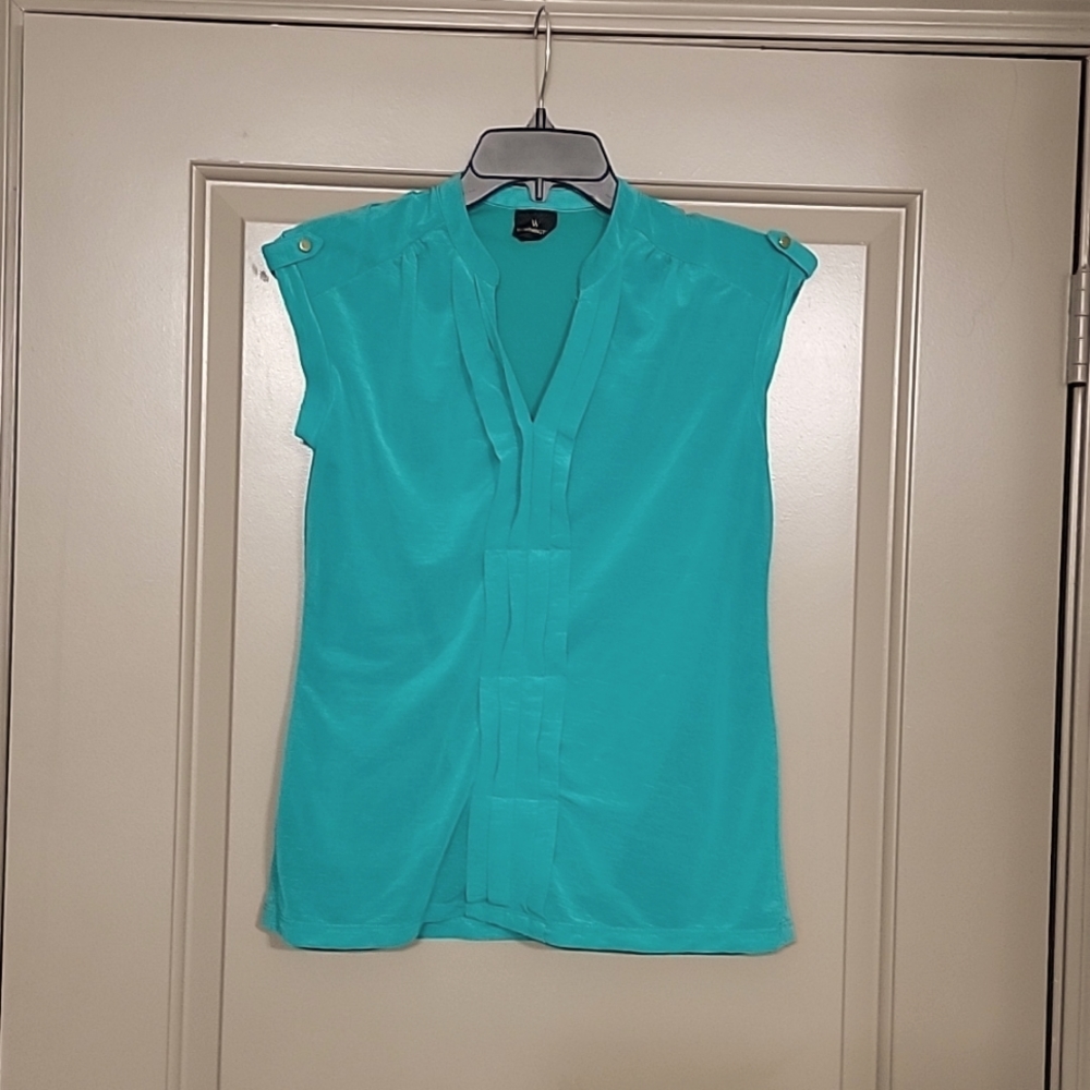 Turquoise sleeveless blouse
